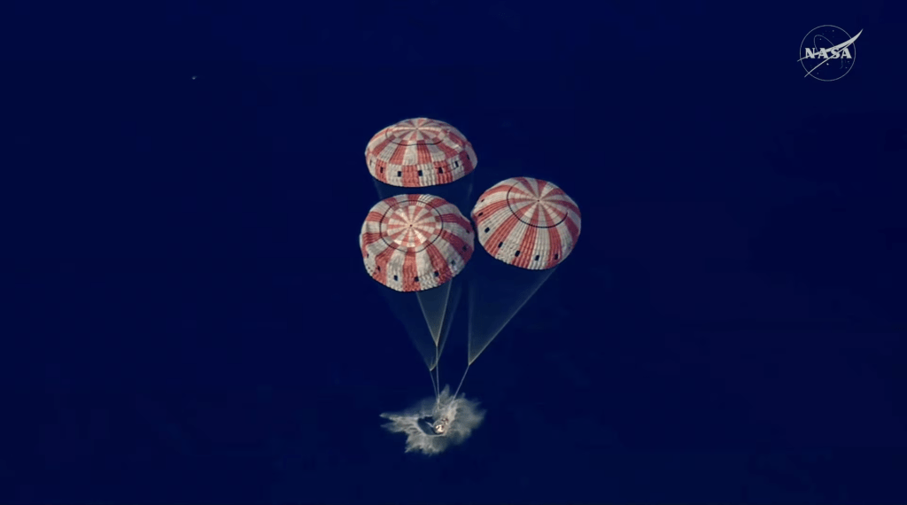 The Artemis II crew capsule splashes down in the Pacific Ocean in this screengrab from a livestream video after the Artemis II crew's flyby of the Moon, April 10, 2026. NASA/Handout via REUTERS 