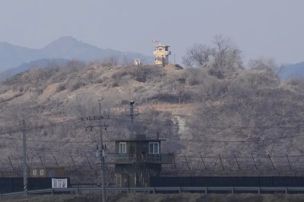 North Korean military guard posts, rear, and South Korea posts, bottom, are seen in Paju, South Korea, near the border with North Korea. (AP) North Korean military guard posts, rear, and South Korea posts, bottom, are seen in Paju, South Korea, near the border with North Korea. (AP)
