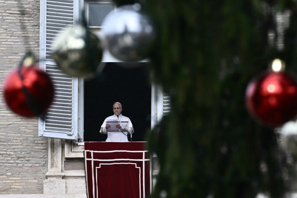 Pope Leo XIV delivers a speech to pilgrims from the window of the apostolic palace overlooking St. Peter's square during his Sunday Angelus prayer at the Vatican on January 4, 2026. (AFP)