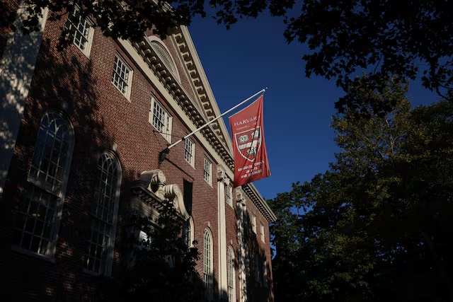 A flag hangs on campus at Harvard University in Cambridge, Massachusetts, U.S., September 4, 2025. REUTERS/Shannon Stapleton