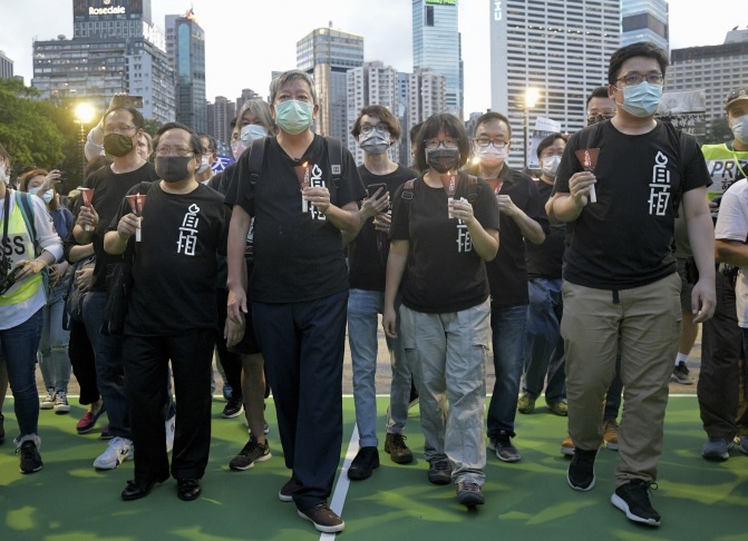 Albert Ho Chun-yan, Lee Cheuk-yan and Tonyee Chow Hang-tung in June 4 vigil last year. Albert Ho Chun-yan, Lee Cheuk-yan and Tonyee Chow Hang-tung in June 4 vigil last year.