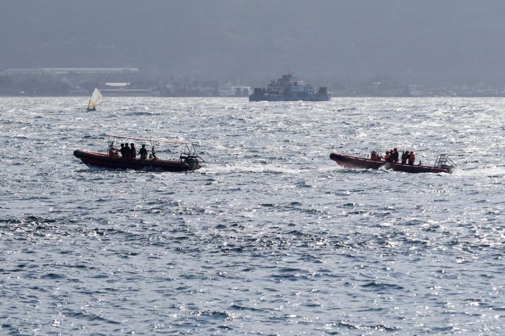 Indonesia rescue team members sail on dinghies during a search operation for missing passengers, after the KMP Tunu Pratama Jaya ferry carrying 65 people sank near the Indonesian island of Bali, in Bali, Indonesia, July 3, 2025. (REUTERS/Johannes P. Christo)
