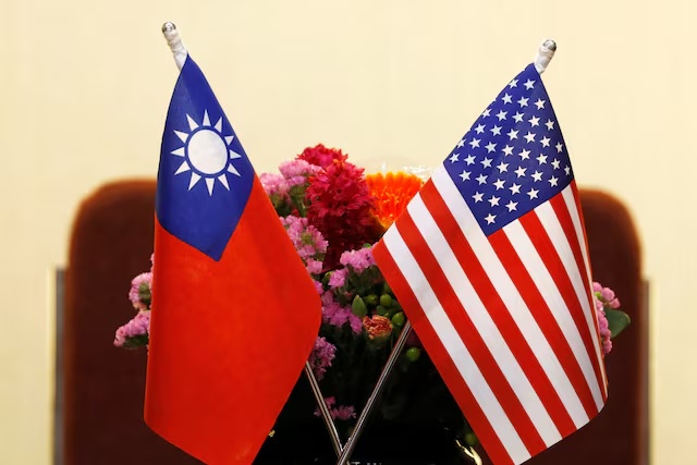 Flags of Taiwan and U.S. are placed on a table ahead of a meeting in Taipei, Taiwan March 27, 2018. REUTERS/Tyrone Siu/File photo