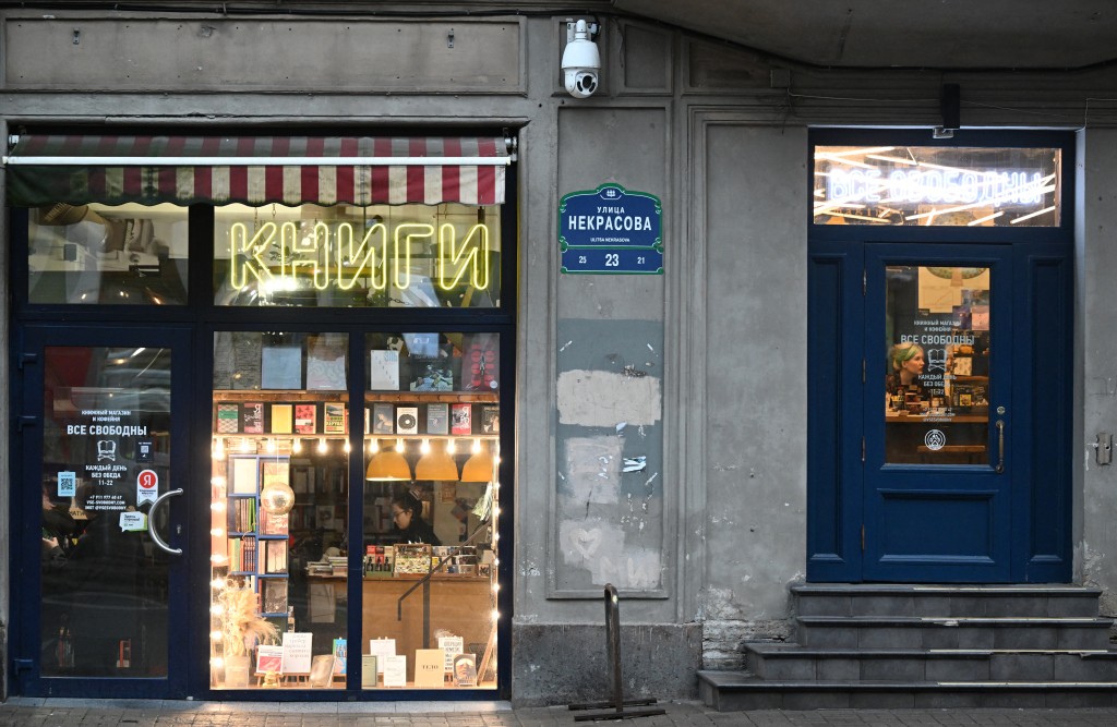 Russian bookseller Lyubov Belyatskaya is seen in her bookshop -- called "Vse Svobodny" or "Everyone is free" -- in central Saint Petersburg on November 13, 2025. (Photo by Olga MALTSEVA / AFP)