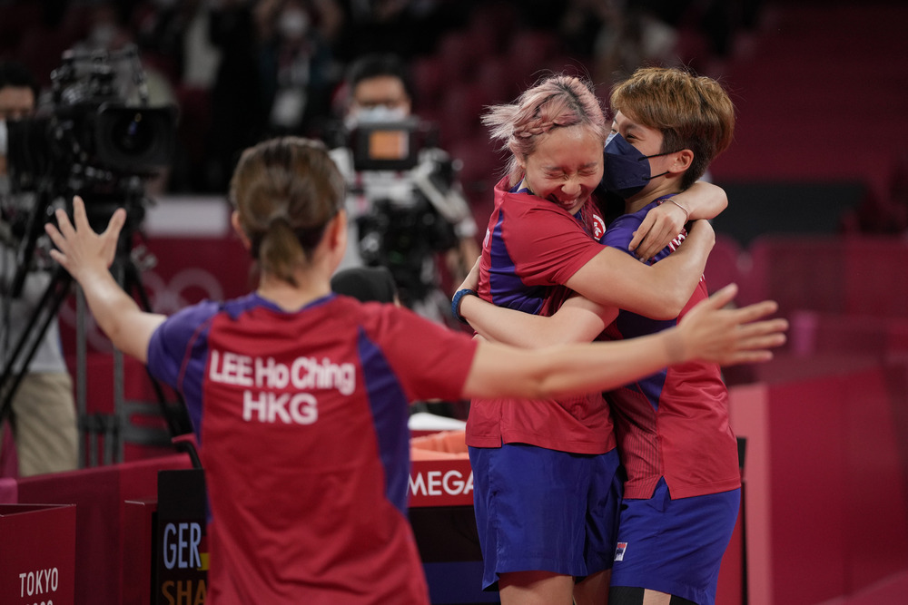 Lee Ho-ching rushes to join in the celebrations as Doo Hoi-kem gives Minnie Soo a congratulatory hug after she came through to seal a 3-1 victory against Germany. Below, Soo in action.AP, AFP Lee Ho-ching rushes to join in the celebrations as Doo Hoi-kem gives Minnie Soo a congratulatory hug after she came through to seal a 3-1 victory against Germany. Below, Soo in action.AP, AFP