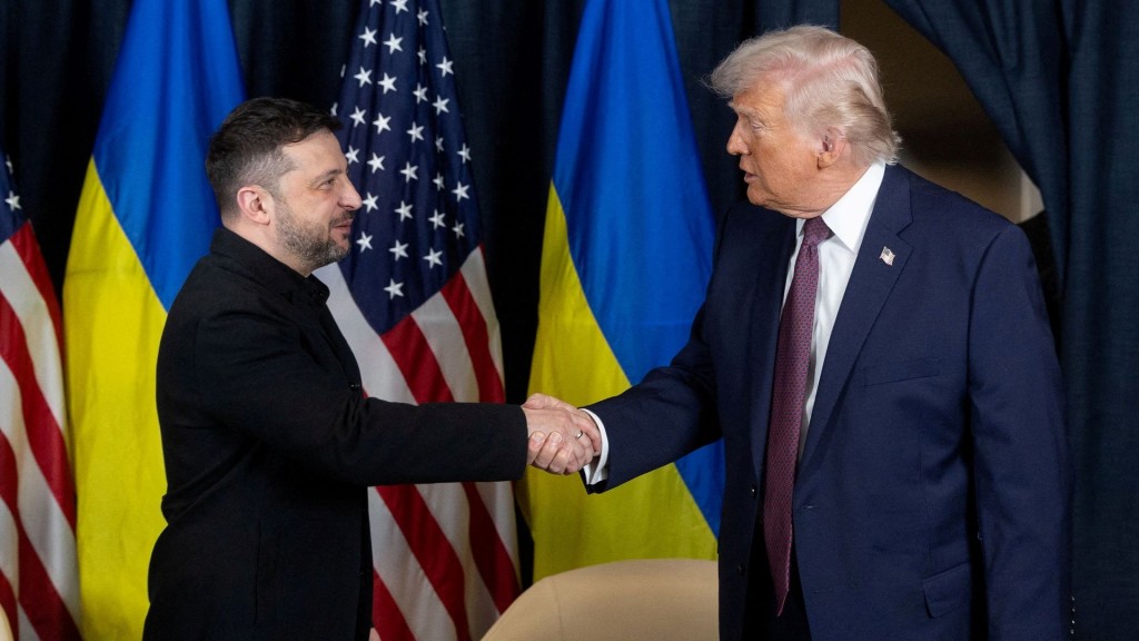 Ukraine's President Volodymyr Zelensky and U.S. President Donald Trump shake hands during their meeting in Davos. Reuters