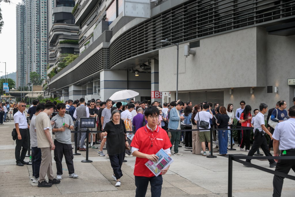 Visitors outside the Pavilia Farm III's sales office on Sunday.