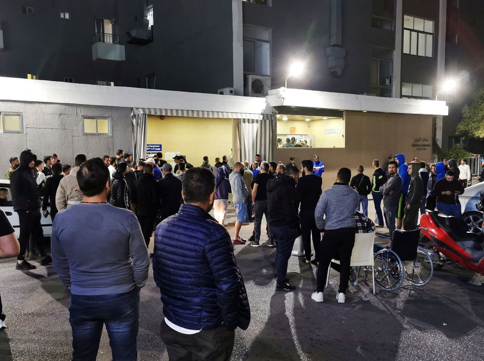 Men gather outside a hospital where some injured people are believed to be transferred to, after an explosion, near Sidon in southern Lebanon. (Reuters) Men gather outside a hospital where some injured people are believed to be transferred to, after an explosion, near Sidon in southern Lebanon. (Reuters)