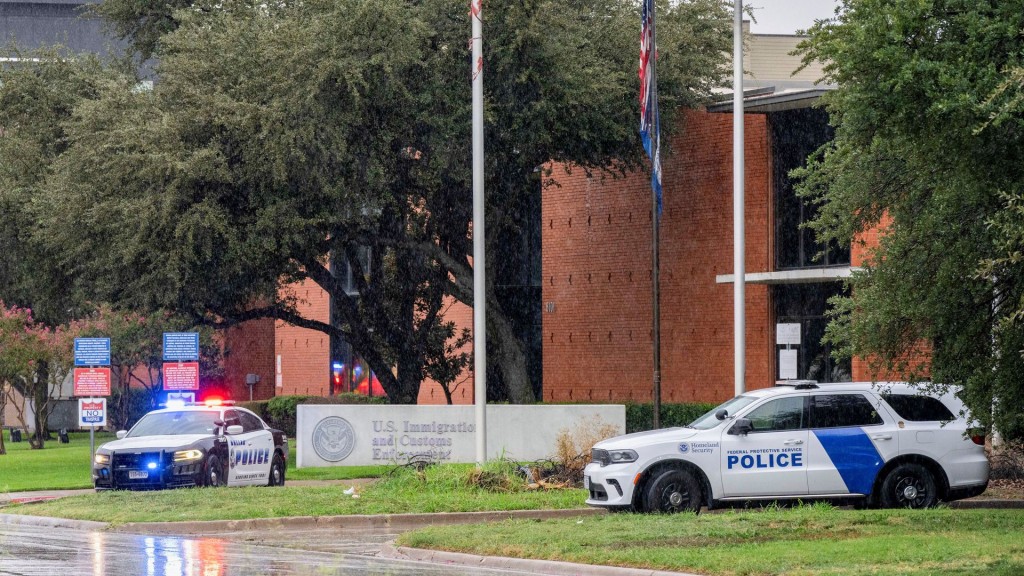 Law enforcement personnel respond at the scene of a shooting at an ICE field office in Dallas. Reuters