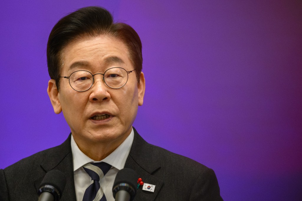 South Korea President Lee Jae Myung holds a press conference at the Blue House in Seoul on December 3, 2025, on the first anniversary of the declaration of martial law by ousted president Yoon Suk Yeol. (Photo by ANTHONY WALLACE / AFP)