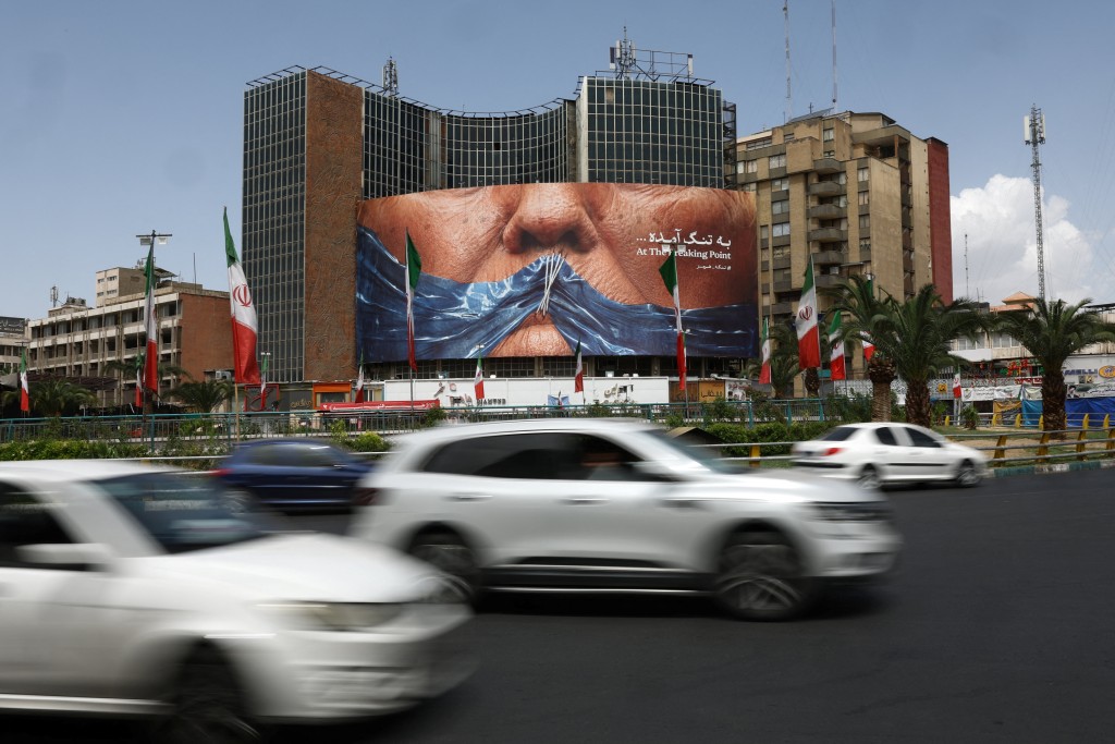 Vehicles drive past an anti-U.S. billboard depicting U.S. President Donald Trump and the Strait of Hormuz, in Tehran, Iran, May 8, 2026. (Reuters)