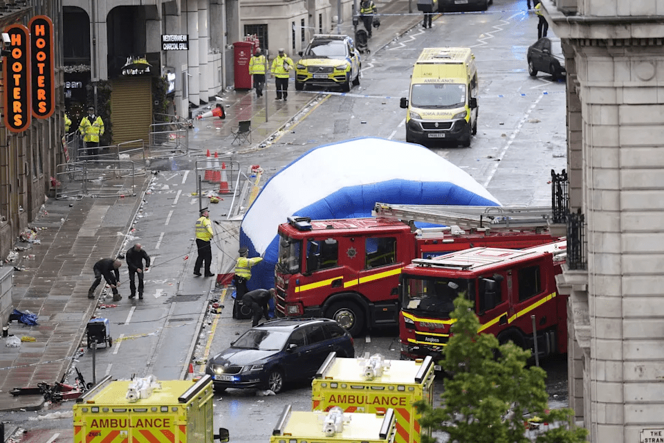 A tent is erected by police at the site of an incident on Water Street near the Liver Building in Liverpool after a car collided with pedestrians during the Premier League winners parade, in Liverpool, England, Monday May 26, 2025. (Danny Lawson/PA via AP)ASSOCIATED PRESS