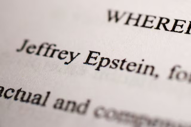 Newly-released documents from disgraced late financier and sex offender Jeffrey Epstein, referencing court cases against him, are seen in this handout released by the U.S. Justice Department and printed and arranged for a photograph by Reuters in Washington, D.C., U.S., December 19, 2025. REUTERS/Jonathan Ernst/File Photo