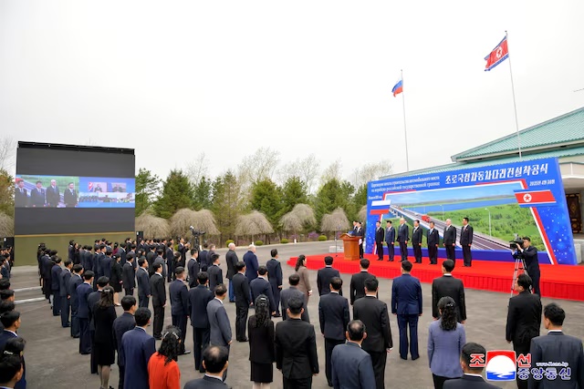 Officials attend a ground-breaking ceremony for a new road bridge spanning the Tumen River that will link North Korea to Russia in Rason Municipality, North Korea, April 30, 2025, in this photo released by North Korea's official Korean Central News Agency. KCNA via REUTERS/ File Photo