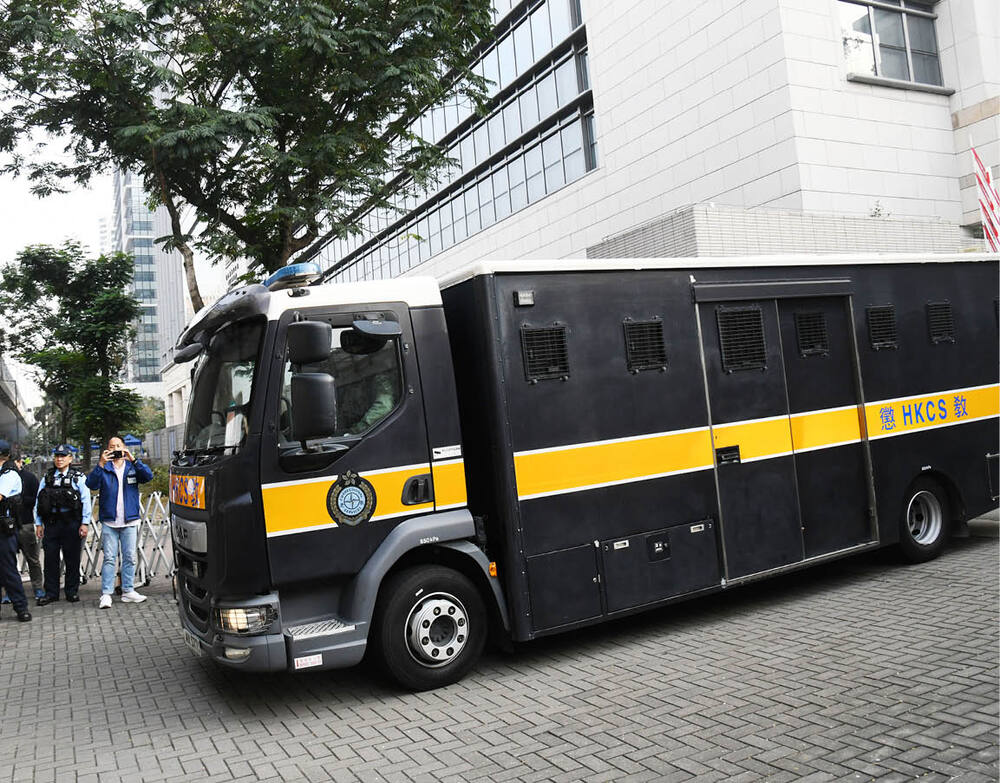 A prison van takes Jimmy Lai from court. A prison van takes Jimmy Lai from court.