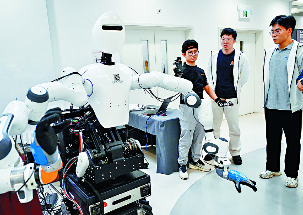 A robot gets a tryout at a Chinese University AI exhibition. SING TAO A robot gets a tryout at a Chinese University AI exhibition. SING TAO