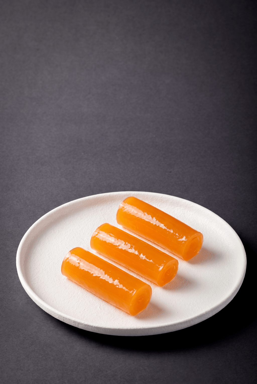 Orange Juice Roll (Maxim’s Palace, festival exclusive) - once a familiar sight in old-school Hong Kong tea houses, the nostalgic orange juice roll returns with a translucent, gently chewy texture and refreshing citrus aroma.