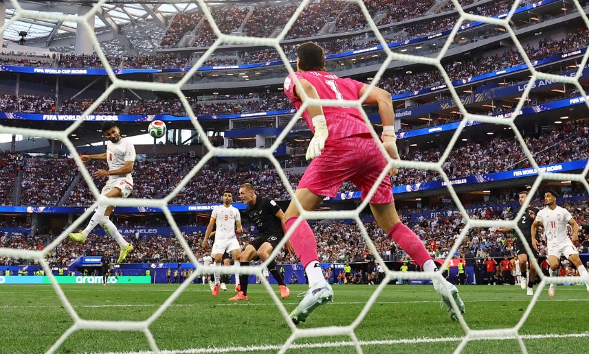 Mohammad Mohebbi heads home Iran’s equalizer past New Zealand ‘keeper Max Crocombe. REUTERS