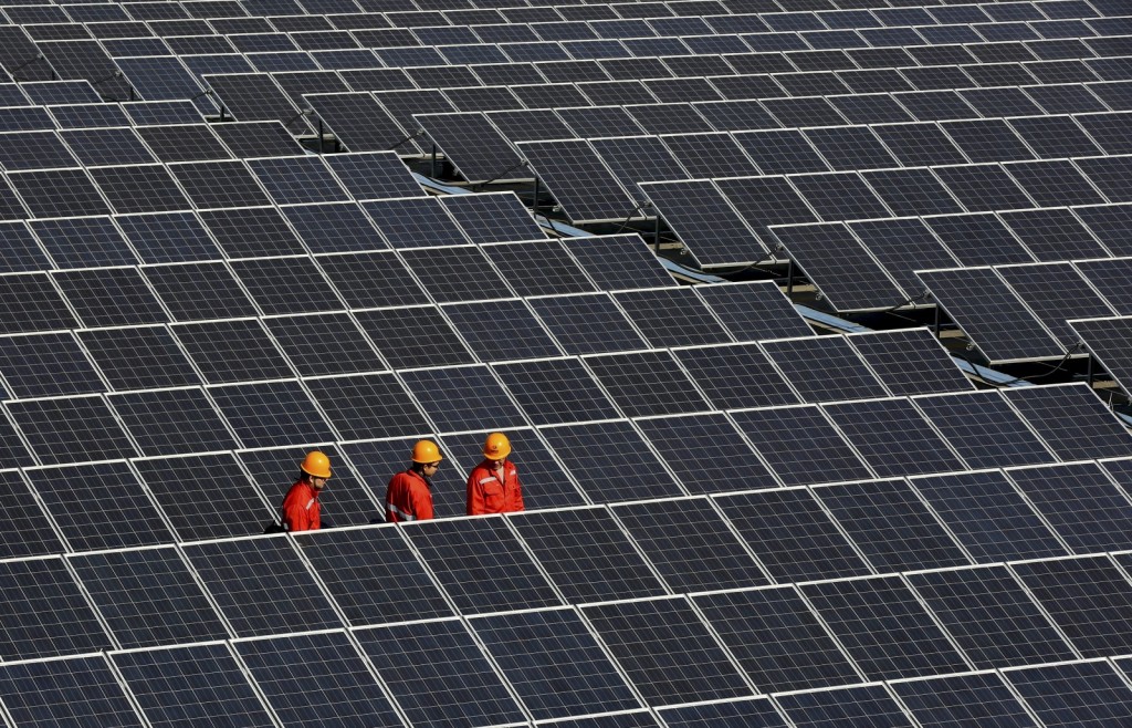 A solar power plant in Zhouquan township of Tongxiang, Zhejiang province, in December 2014. Photo by REUTERS