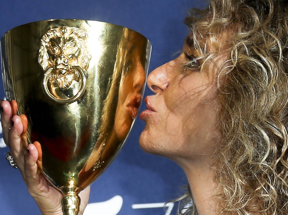 Actress Valeria Golino poses with her Coppa Volpi for best actress for her role in the movie 'For your love'. 