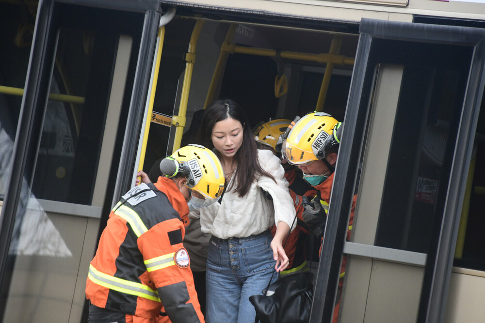 The Fire Services Department said 58 passengers were trapped on the upper deck after the crash, while 14 of the 18 passengers on the lower deck jumped out of the rear emergency exit before first responders arrived.