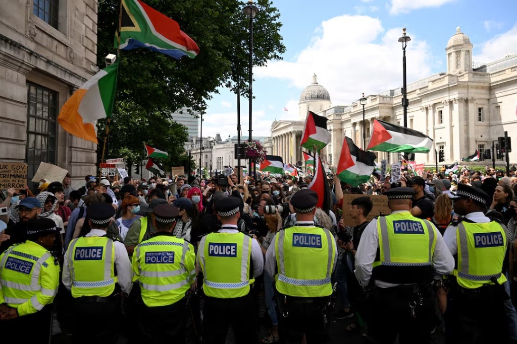 Police officers block a street as pro-Palestinian demonstrators gather in protest against Britain's Home Secretary Yvette Cooper's plans to proscribe the "Palestine Action" group in the coming weeks, in London, Britain, June 23, 2025. REUTERS/Jaimi Joy 