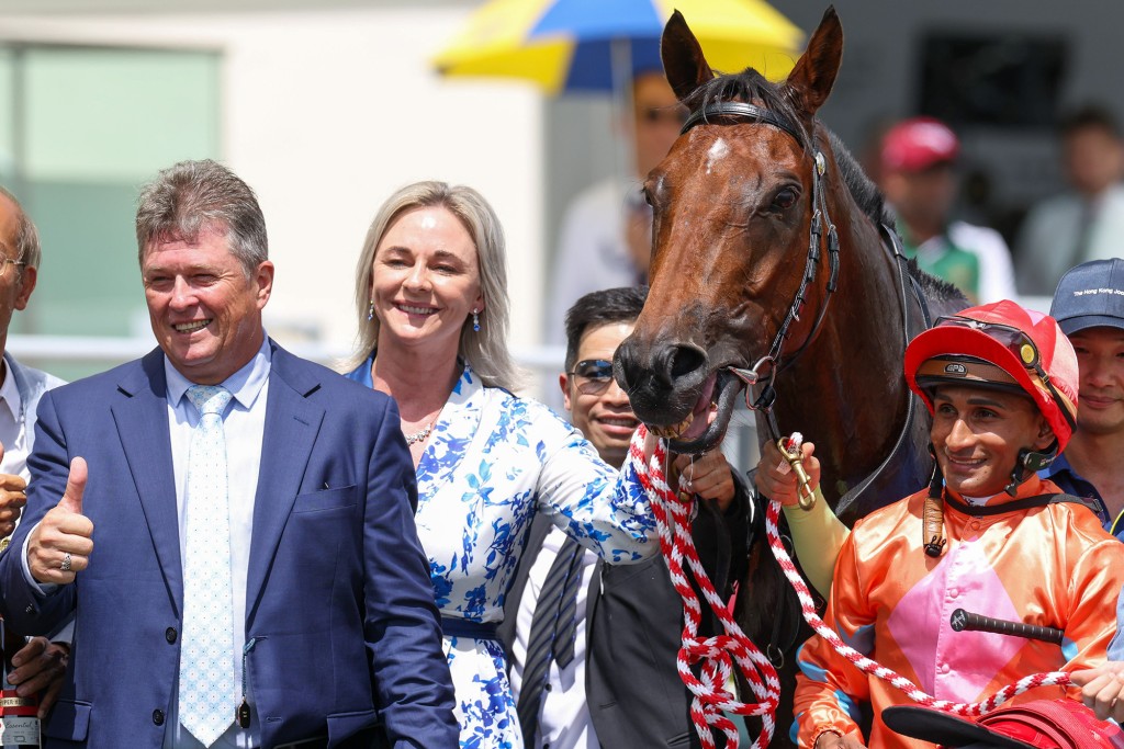 Brett Crawford, alongside his wife Gwen and winning jockey Karis Teetan, celebrates the first win of his Hong Kong career with Speedy Smartie (HKJC) 