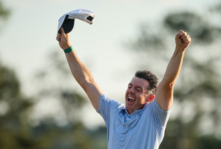 Rory McIlroy celebrates after winning a second Masters title in a row at Augusta National. AFP