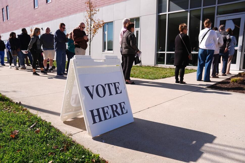FILE - Voters wait in line to cast there ballot at a polling place at Rowan College in Mt Laurel, N.J., Oct. 27, 2025. (AP Photo/Matt Rourke, File)