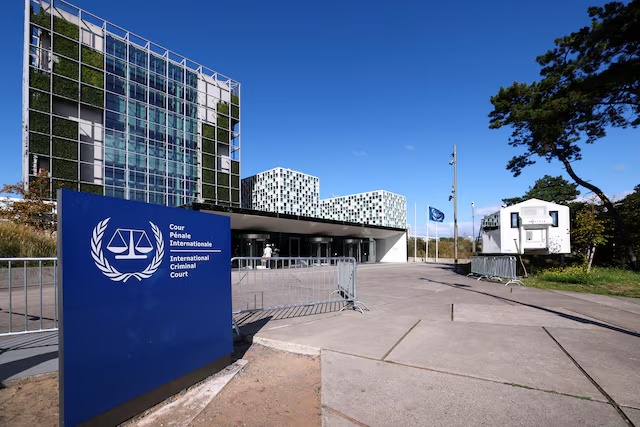 People stand outside the International Criminal Court in The Hague, Netherlands, September 22, 2025. REUTERS/Piroschka van de Wouw/File Photo