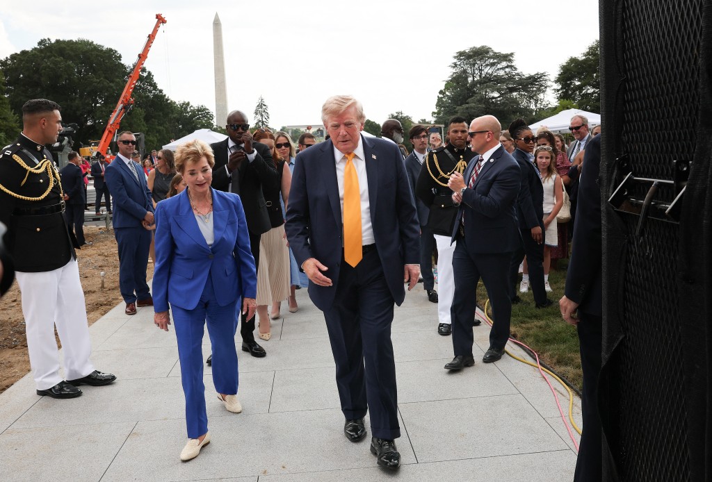 U.S. President Donald Trump walks with Secretary of Education Linda McMahon after giving a tour of the White House helipad construction on the South Lawn of the White House after an event in the Rose Garden of the White House on August 24, 2026 in Washington, DC. The multimillion-dollar granite helipad is designed to accommodate Marine One helicopters and is slated for completion in 2026. Win McNamee/Getty Images/AFP