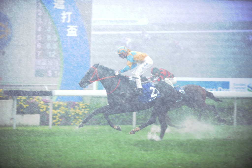 Mr Medici, with Gerald Mosse aboard, wins the Champions & Chater Cup in torrential rain at Sha Tin in 2010.