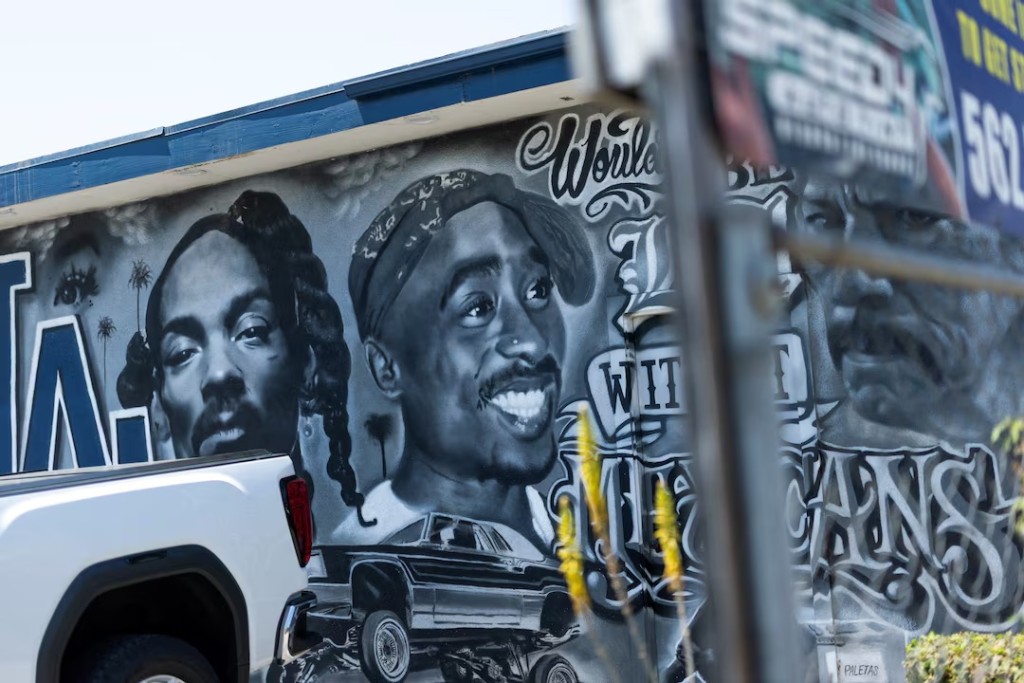 A mural depicting late rapper Tupac Shakur on the side of a building in Bellflower California, during the opening day of the trial for Duane Davis, who is charged for his alleged role in leading a group of men to kill Shakur in a 1996 drive-by shooting near the Las Vegas Strip, U.S., August 10, 2026. REUTERS/Mike Blake