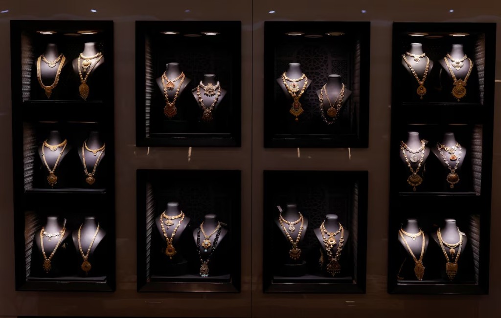 Gold necklaces are displayed on shelves at a jewellery store in Mumbai, India, March 20, 2025. REUTERS
