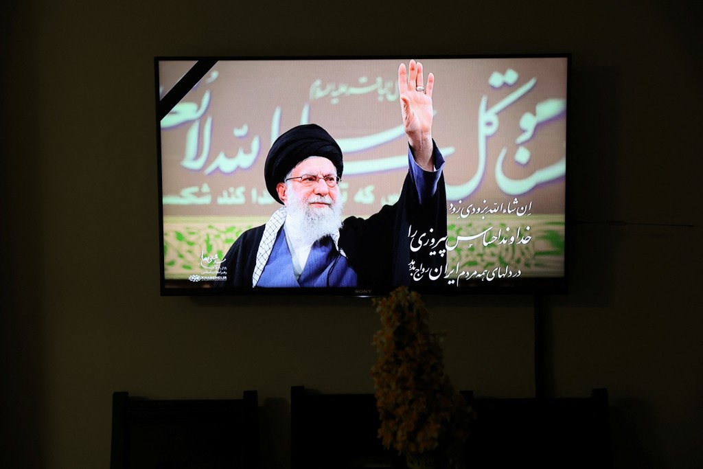 A photo of the late Iranian Supreme Leader Ayatollah Ali Khamenei is shown on TV when the news of his death is announced, in Tehran, Iran March 1, 2026. (Reuters)