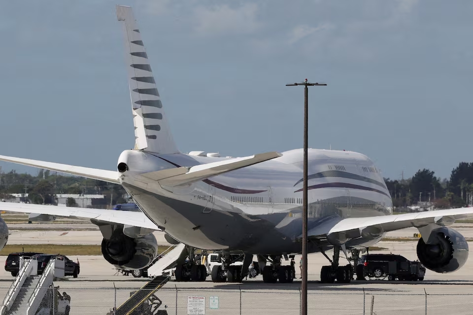 The motorcade of U.S. President Donald Trump is parked next to a 12-year old Qatari-owned Boeing 747-8 that Trump was touring in West Palm Beach, Florida, U.S., February 15, 2025. (Reuters)