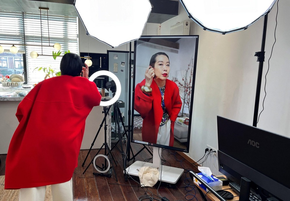 Influencer Tera Feng prepares before hosting a livestream sales session on the social media platform Xiaohongshu, at her apartment in Shanghai. Reuters Influencer Tera Feng prepares before hosting a livestream sales session on the social media platform Xiaohongshu, at her apartment in Shanghai. Reuters