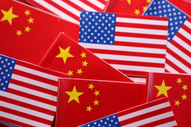 U.S. and Chinese flags are seen in this illustration taken March 20, 2025. REUTERS/Dado Ruvic/Illustration/File Photo
