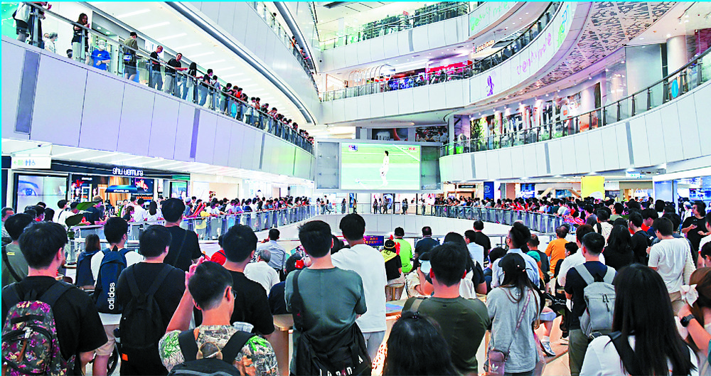 Hong Kong football fans flock to the malls and cinemas to watch the game against Japan. SING TAO