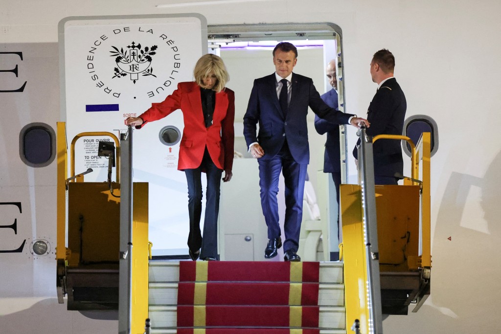 France's President Emmanuel Macron and his wife Brigitte Macron arrive at Noi Bai International Airport, marking the first trip to Vietnam by a French president in nearly a decade, in Hanoi, Vietnam, May 25, 2025. (Reuters)