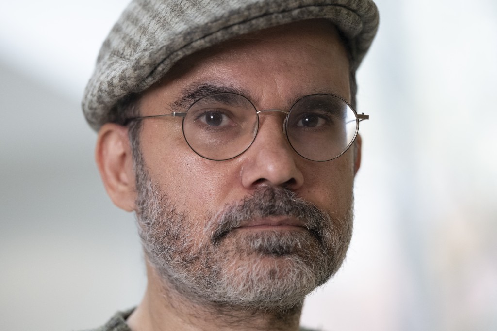 Photo by MARTIN LELIEVRE / AFP  Exiled Iranian cartoonist Mana Neyestani poses within an interview with AFP in Paris on April 2, 2026.