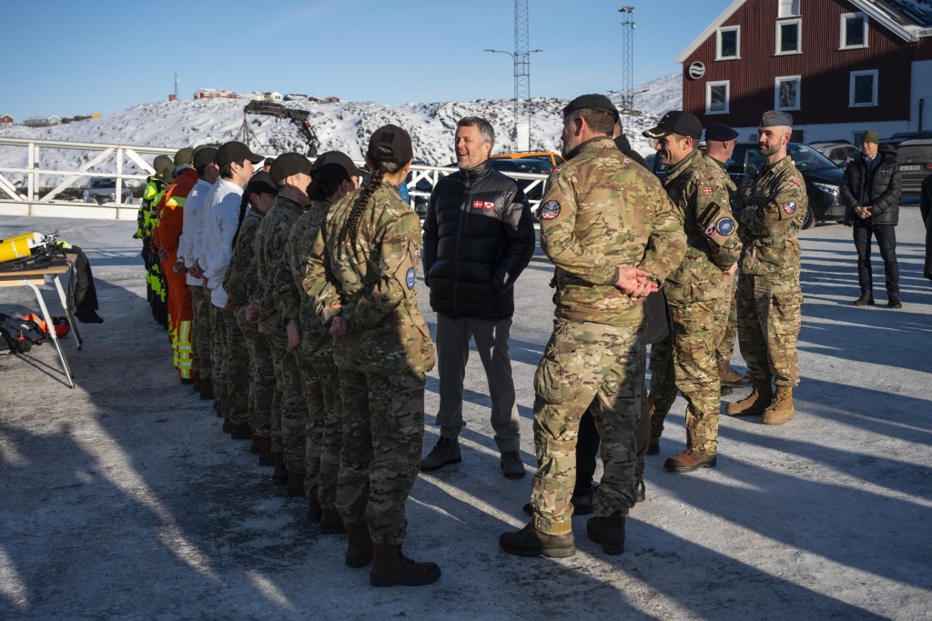Denmark’s King Frederik X speaks with recruits of the Joint Arctic Command during a visit to the port of Nuuk, Greenland, on February 18, 2026. (AFP)