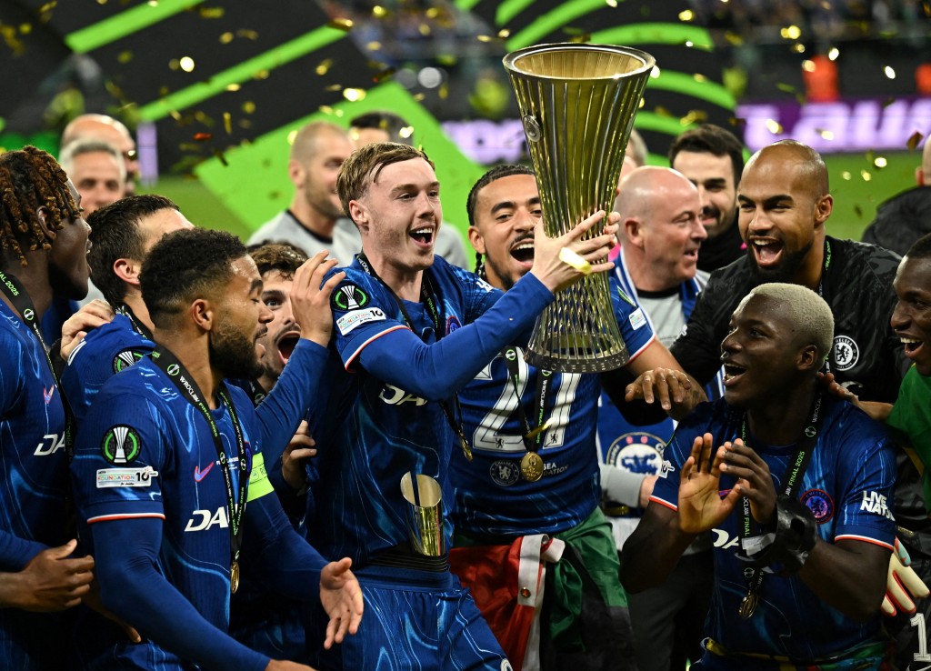 Chelsea's Cole Palmer lifts the trophy as he celebrates with teammates after winning the Conference League. (Reuters)
