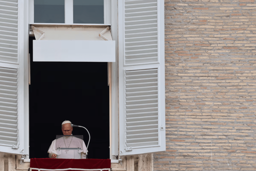 Pope Leo appears at a window of the Apostolic Palace, in his first public event since cancer surgery, at the Vatican, October 18, 2026. REUTERS/Yara Nardi