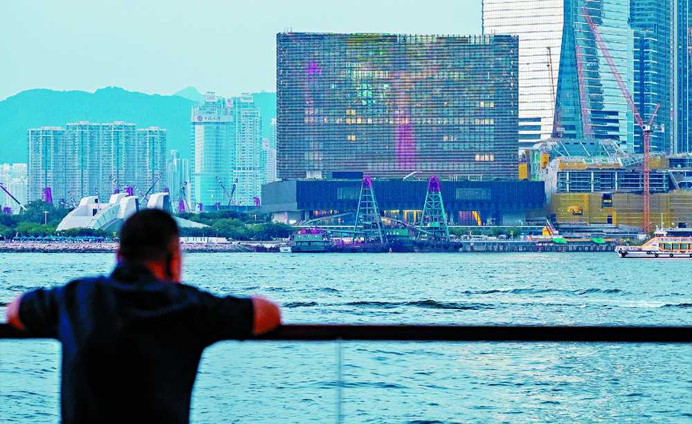 Clockwise from above: the M+ Museum facade, info on the water taxis' landing facility, an artist creating a Picasso-inspired sand painting and Betty Fung providing details about the culture hub. SING TAO Clockwise from above: the M+ Museum facade, info on the water taxis' landing facility, an artist creating a Picasso-inspired sand painting and Betty Fung providing details about the culture hub. SING TAO
