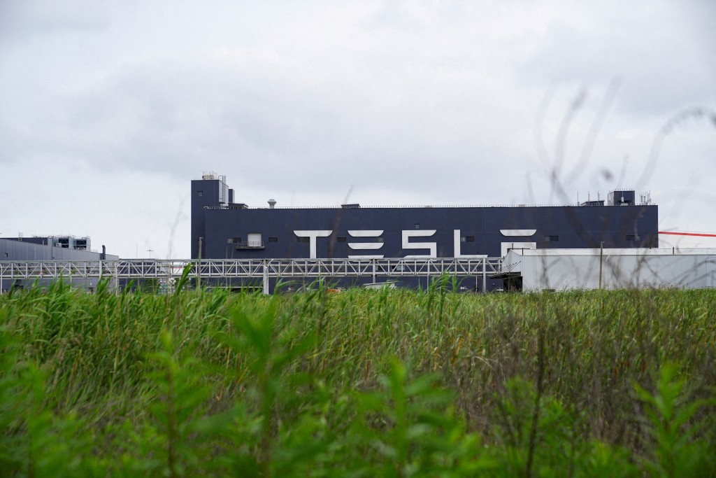 A view of a Tesla sign at its factory in Shanghai, China June 12, 2023. REUTERS