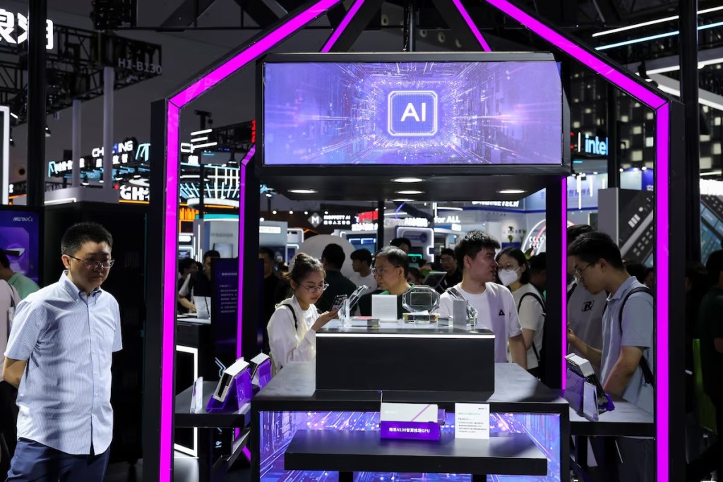 People visit a Metax booth during the World Artificial Intelligence Conference in Shanghai, China July 26, 2025. REUTERS