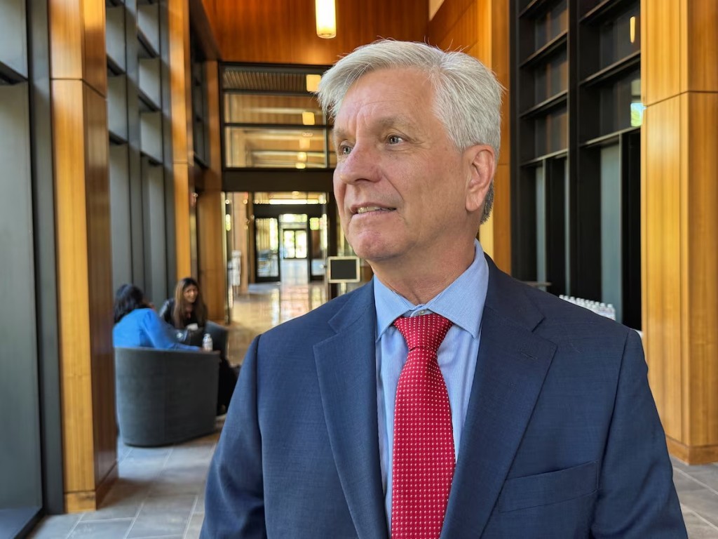 Federal Reserve Governor Christopher Waller converses on the sidelines of a monetary policy conference at Stanford University's Hoover Institution in Palo Alto, California, U.S., May 9, 2025. REUTERS