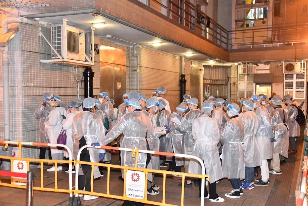 Large crowds of medics are spotted outside the Tuen Mun building. 