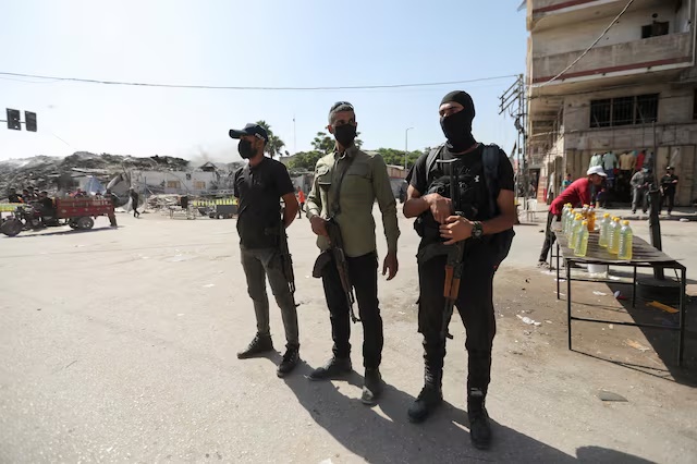 Hamas police officers stand guard, amid a ceasefire between Israel and Hamas, in Gaza City, October 11, 2025. REUTERS/Stringer 